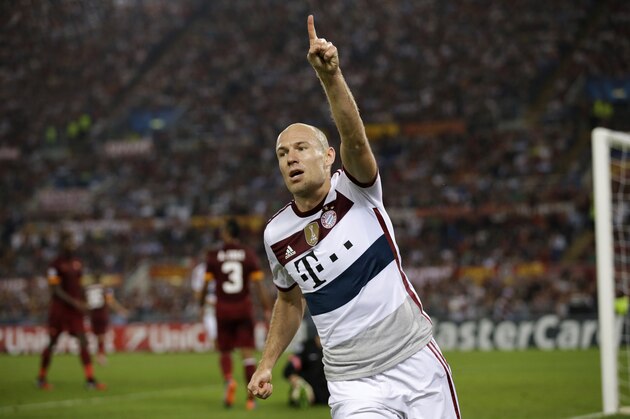 Bayern's Arjen Robben celebrates after scoring his sides fourth goal during the Group E Champions League soccer match between Roma and Bayern Munich at the Olympic stadium, in Rome, Tuesday, Oct. 21, 2014. (AP Photo/Andrew Medichini)