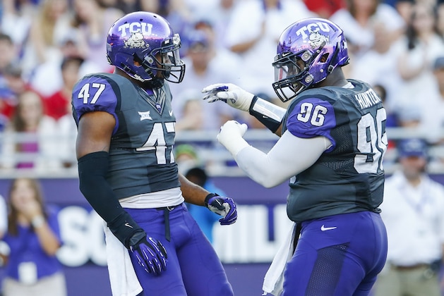 Oct 25, 2014; Fort Worth, TX, USA; TCU Horned Frogs linebacker Paul Dawson (47) celebrates with defensive tackle Chucky Hunter (96) during the game against the Texas Tech Red Raiders at Amon G. Carter Stadium. Mandatory Credit: Kevin Jairaj-USA TODAY Sports