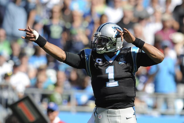Carolina Panthers quarterback Cam Newton (1) signals a first down against the Seattle Seahawks during the first half of an NFL football game, Sunday, Oct. 26, 2014, in Charlotte. (AP Photo/Mike McCarn)