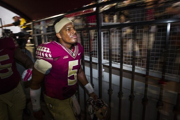 Florida State quarterback Jameis Winston heads out the tunnel after defeating Notre Dame 31-27 in an NCAA college football game in Tallahassee, Fla., Saturday, Oct. 18, 2014. (AP Photo/Mark Wallheiser)
