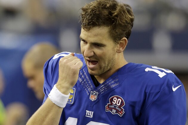 New York Giants quarterback Eli Manning (10) reacts on the sideline during the second half of an NFL football game against the Dallas Cowboys, Sunday, Oct.  19, 2014, in Arlington, Texas. (AP Photo/LM Otero)