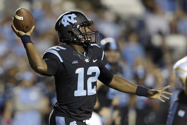 North Carolina quarterback Marquise Williams passes against Georgia Tech during the first half of an NCAA college football game in Chapel Hill, N.C., Saturday, Oct. 18, 2014. (AP Photo/Gerry Broome)