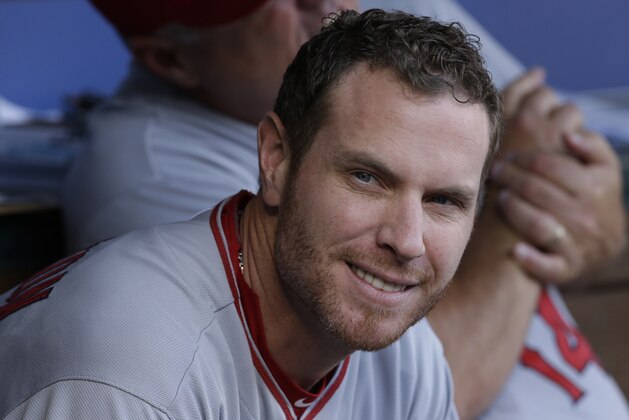 Los Angeles Josh Hamilton sits in the dugout during a baseball game against the Texas Rangers in Arlington, Texas, Saturday, July 12, 2014. (AP Photo/LM Otero)
