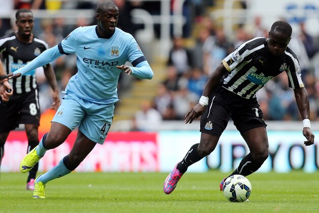 Newcastle United's Moussa Sissoko, right, vies for the ball with Manchester City's Yaya Toure, left, during their English Premier League soccer match at St James' Park, Newcastle, England, Sunday, Aug. 17, 2014. (AP Photo/Scott Heppell) Newcastle United's Moussa Sissoko, right, vies for the ball with Manchester City's Yaya Toure, left, during their English Premier League soccer match at St James' Park, Newcastle, England, Sunday, Aug. 17, 2014. (AP Photo/Scott Heppell)