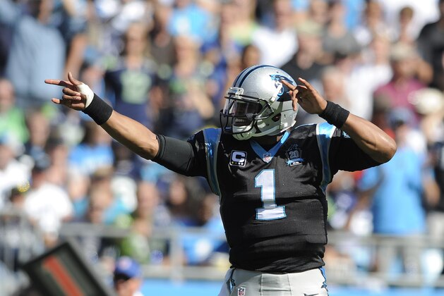 Carolina Panthers quarterback Cam Newton (1) signals a first down against the Seattle Seahawks during the first half of an NFL football game, Sunday, Oct. 26, 2014, in Charlotte. (AP Photo/Mike McCarn)