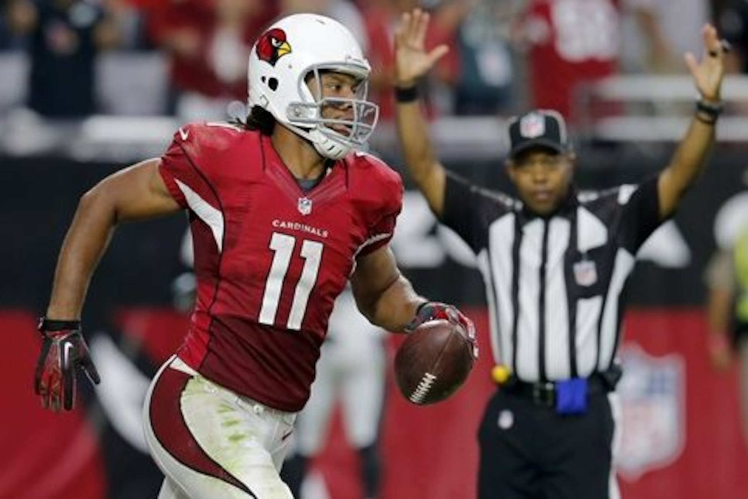 CORRECTS TO SECOND HALF NOT FIRST HALF - Arizona Cardinals wide receiver Larry Fitzgerald (11) scores a touchdown against the Philadelphia Eagles during the second half of an NFL football game, Sunday, Oct. 26, 2014, in Glendale, Ariz. (AP Photo/Rick Scuteri) CORRECTS TO SECOND HALF NOT FIRST HALF - Arizona Cardinals wide receiver Larry Fitzgerald (11) scores a touchdown against the Philadelphia Eagles during the second half of an NFL football game, Sunday, Oct. 26, 2014, in Glendale, Ariz. (AP Photo/Rick Scuteri)