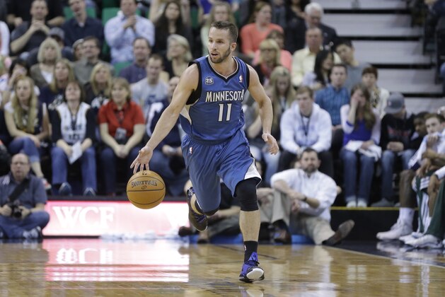 Minnesota Timberwolves' J.J. Barea (11) brings the ball up court in the second half of an NBA basketball game against the Utah Jazz Saturday Feb. 22, 2014, in Salt Lake City. (AP Photo/Rick Bowmer)