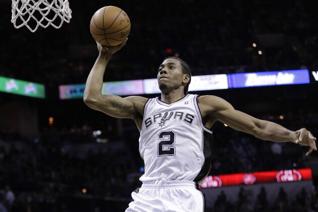 San Antonio Spurs' Kawhi Leonard (2) scores against the Portland Trail Blazers during the second half of Game 5 of a Western Conference semifinal NBA basketball playoff series, Wednesday, May 14, 2014, in San Antonio. (AP Photo/Eric Gay)