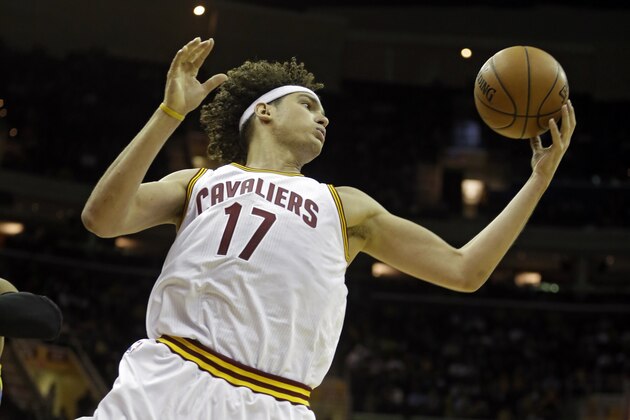 Cleveland Cavaliers' Anderson Varejao grabs a rebound against Maccabi Tel Aviv in the this quarter of a preseason exhibition basketball game Sunday, Oct. 5, 2014, in Cleveland. (AP Photo/Mark Duncan)