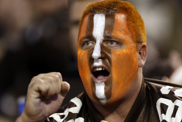 A Cleveland Browns fan cheers during an NFL football game between the Oakland Raiders and Cleveland Browns Sunday, Oct. 26, 2014, in Cleveland. (AP Photo/Tony Dejak)