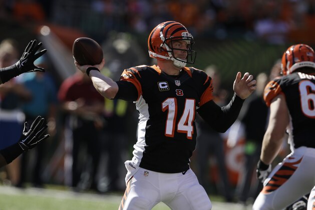 Cincinnati Bengals quarterback Andy Dalton throws against the Baltimore Ravens during the first half of an NFL football game in Cincinnati, Sunday, Oct. 26, 2014. (AP Photo/Darron Cummings)