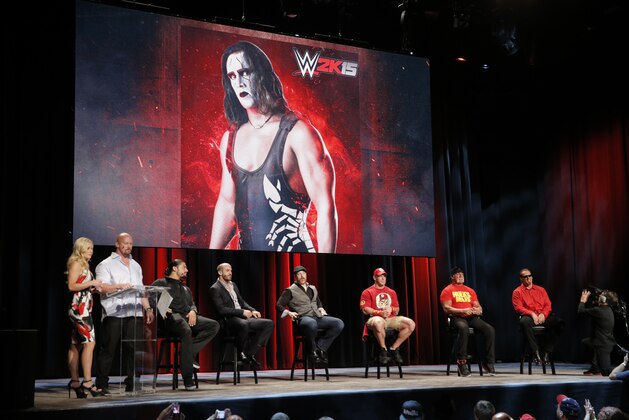 WWE broadcaster Renee Young, WWE Hall of Famer Stone Cold Steve Austin speaks with WWE Superstars Roman Reigns, Cesaro, Sheamus, WWE 2K15 cover Superstar John Cena as well as WWE Hall of Famer Hulk Hogan and iconic competitor Sting talk about WWE 2K15 at the SummerSlam Confidential Panel at Club Nokia, on Saturday, August 16, 2014 in Los Angeles. (Photo by Todd Williamson/Invision for 2K/AP Images)