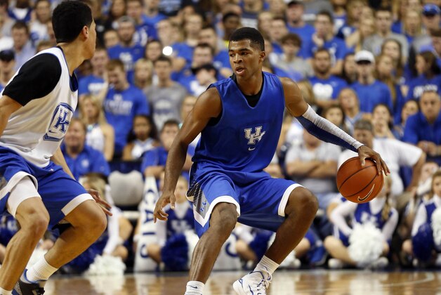 Oct 27, 2014; Lexington, KY, USA; Kentucky Wildcats guard Andrew Harrison (5) dribbles the ball against guard Devin Booker (1) during the Blue-White Scrimmage at Rupp Arena. Mandatory Credit: Mark Zerof-USA TODAY Sports