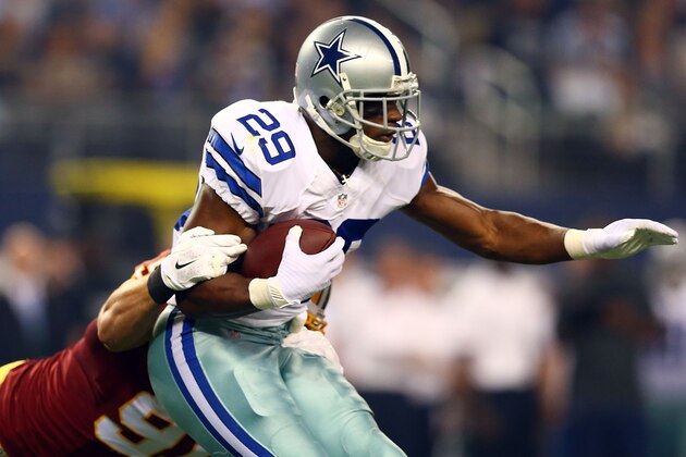 ARLINGTON, TX - OCTOBER 27:  DeMarco Murray #29 of the Dallas Cowboys carries the ball as Ryan Kerrigan #91 of the Washington Redskins tries to make the tackle during the first half at AT&T Stadium on October 27, 2014 in Arlington, Texas.  (Photo by Ronald Martinez/Getty Images)