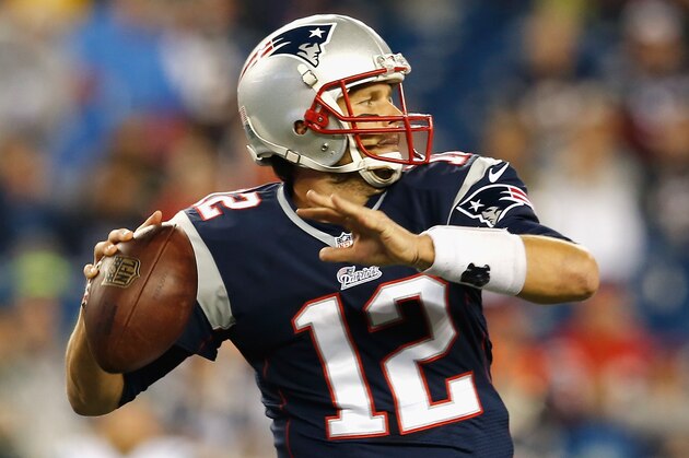 FOXBORO, MA - OCTOBER 16:  Tom Brady #12 of the New England Patriots passes the ball during the first quarter against the New York Jets at Gillette Stadium on October 16, 2014 in Foxboro, Massachusetts.  (Photo by Jim Rogash/Getty Images)