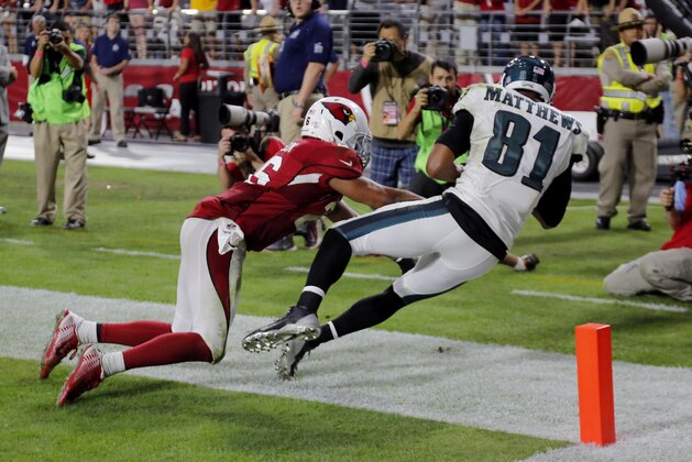 Philadelphia Eagles wide receiver Jordan Matthews (81) can't land in-bounds on the last play of the game as Arizona Cardinals free safety Rashad Johnson (26) defends during the second half of an NFL football game, Sunday, Oct. 26, 2014, in Glendale, Ariz. The Cardianls won 24-20. (AP Photo/Rick Scuteri)