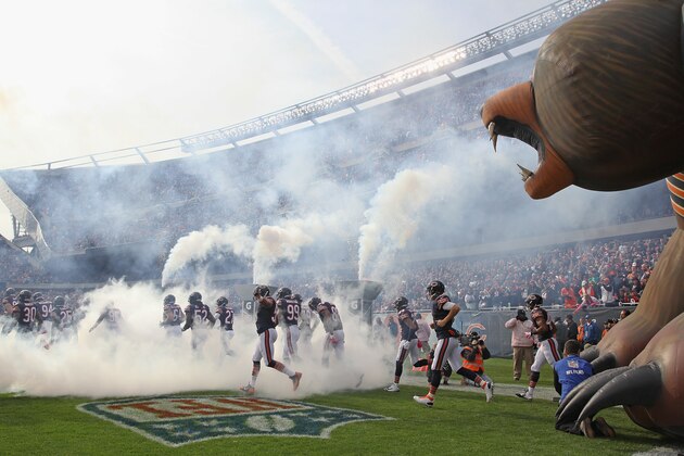 CHICAGO, IL - OCTOBER 19:  Members of the Chicago Bears run onto the field before a game against the Miami Dolphins at Soldier Field on October 19, 2014 in Chicago, Illinois. The Dolphins defeated the Bears 27-14.  (Photo by Jonathan Daniel/Getty Images)