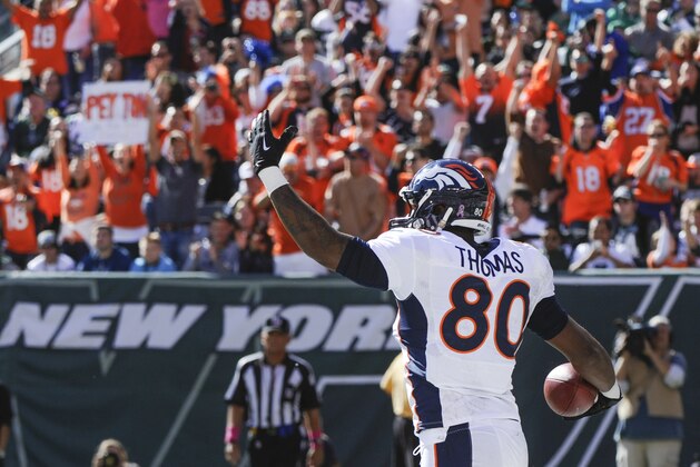 Denver Broncos tight end Julius Thomas (80) reacts after catching a touchdown pass against the New York Jets during the second quarter of an NFL football game, Sunday, Oct. 12, 2014, in East Rutherford, N.J. (AP Photo/Bill Kostroun)