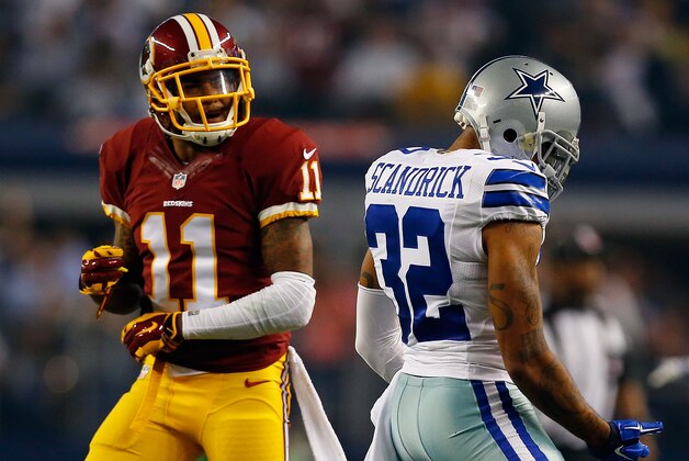 ARLINGTON, TX - OCTOBER 27:  Orlando Scandrick #32 of the Dallas Cowboys reacts after breaking up the pass intended for DeSean Jackson #11 of the Washington Redskins during the first half at AT&T Stadium on October 27, 2014 in Arlington, Texas.  (Photo by Tom Pennington/Getty Images)