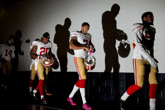 DENVER, CO - OCTOBER 19:  Quarterback Colin Kaepernick #7 of the San Francisco 49ers walks in the tunnel with teammates as he prepares to face the Denver Broncos in a game at Sports Authority Field at Mile High on October 19, 2014 in Denver, Colorado.  (Photo by Justin Edmonds/Getty Images)