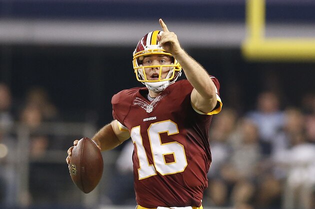 Oct 27, 2014; Arlington, TX, USA; Washington Redskins quarterback Colt McCoy (16) directs his receivers as he scrambles in overtime against the Dallas Cowboys at AT&T Stadium. The Redskins beat the Cowboys 20-17 in overtime. Mandatory Credit: Matthew Emmons-USA TODAY Sports Oct 27, 2014; Arlington, TX, USA; Washington Redskins quarterback Colt McCoy (16) directs his receivers as he scrambles in overtime against the Dallas Cowboys at AT&T Stadium. The Redskins beat the Cowboys 20-17 in overtime. Mandatory Credit: Matthew Emmons-USA TODAY Sports