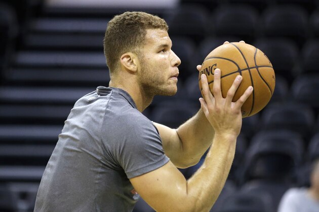 Los Angeles Clippers' Blake Griffin shoots during practice before the start of their NBA pre-season basketball game against the Utah Jazz Monday, Oct. 13, 2014, in Salt Lake City. (AP Photo/Rick Bowmer) .