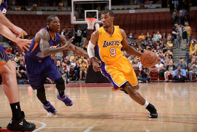 ANAHEIM, CA - OCTOBER 21: Ronnie Price #9 of the Los Angeles Lakers handles the basketball against Eric Bledsoe #2 of the Phoenix Suns on October 21, 2014 at the Honda Center in Anaheim, California. NOTE TO USER:  User expressly acknowledges and agrees that, by downloading and or using this Photograph, user is consenting to the terms and conditions of the Getty Images License Agreement.  Mandatory Copyright Notice:  Copyright 2014 NBAE (Photo by Andrew D. Bernstein/NBAE via Getty Images)