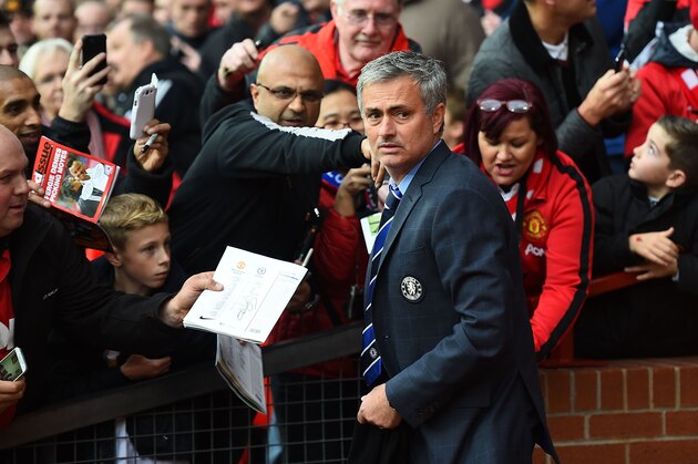 MANCHESTER, ENGLAND - OCTOBER 26:  Chelsea Manager Jose Mourinho is asked for his autograph by fans prior to the Barclays Premier League match between Manchester United and Chelsea at Old Trafford on October 26, 2014 in Manchester, England.  (Photo by Laurence Griffiths/Getty Images)