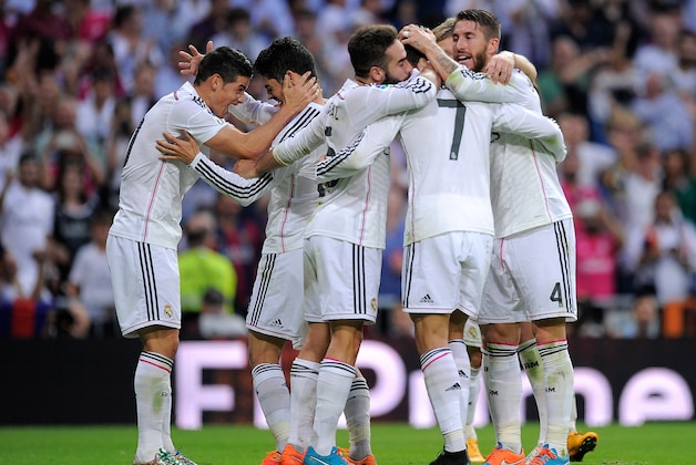MADRID, SPAIN - OCTOBER 25:  James Rodriguez (L) of Real Madrid celebrates with Isco after Real scored their 3rd goal  during the La Liga match between Real Madrid CF and FC Barcelona at Estadio Santiago Bernabeu on October 25, 2014 in Madrid, Spain.  (Photo by Denis Doyle/Getty Images)