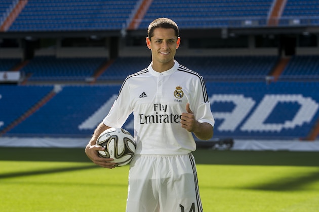 Mexico international soccer player Javier Hernandez 'Chicharito', poses during his official presentation at the Santiago Bernabeu stadium in Madrid, Spain, Monday, Sept. 1, 2014, after signing for Real Madrid. (AP Photo/Andres Kudacki)