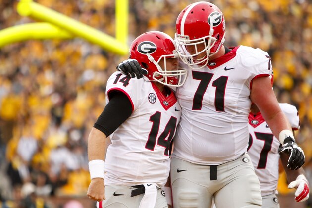 COLUMBIA, MO - OCTOBER 11:  Hutson Mason #14 celebrates with John Theus #71 of the Georgia Bulldogs after Hutson Mason scored the first touchdown of the game to put the bulldogs up 13 to o against the Missouri Tigers on October 11, 2014 at Faurot Field/Memorial Stadium in Columbia, Missouri. (Photo by Kyle Rivas/Getty Images)