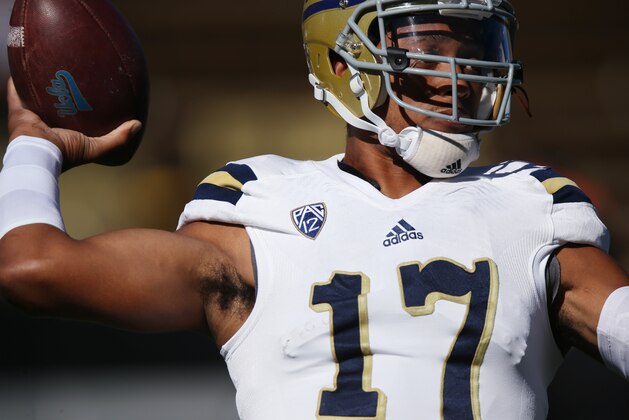 UCLA quarterback Brett Hundley warms up before facing Colorado in the first quarter of an NCAA football game in Boulder, Colo., on Saturday, Oct. 25, 2014. (AP Photo/David Zalubowski)