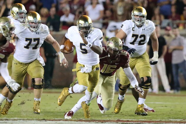Notre Dame's Everett Golson carries as Florida State's Jacob Pugh comes in for the tackle during the second quarter of an NCAA college football game, Saturday, Oct. 18, 2014, in Tallahassee, Fla. Florida State won 31-27. (AP Photo/Steve Cannon)