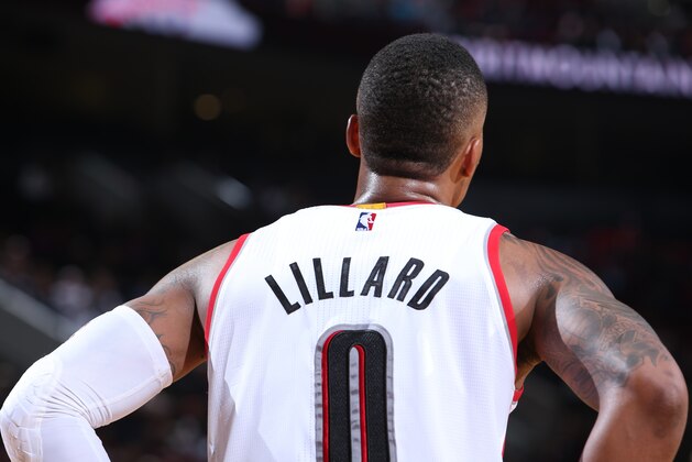 PORTLAND, OR - OCTOBER 17:  Damian Lillard #0 of the Portland Trail Blazers during the game against Maccabi Haifa on October 17, 2014 at the Moda Center Arena in Portland, Oregon. NOTE TO USER: User expressly acknowledges and agrees that, by downloading and or using this photograph, user is consenting to the terms and conditions of the Getty Images License Agreement. Mandatory Copyright Notice: Copyright 2014 NBAE (Photo by Sam Forencich/NBAE via Getty Images)