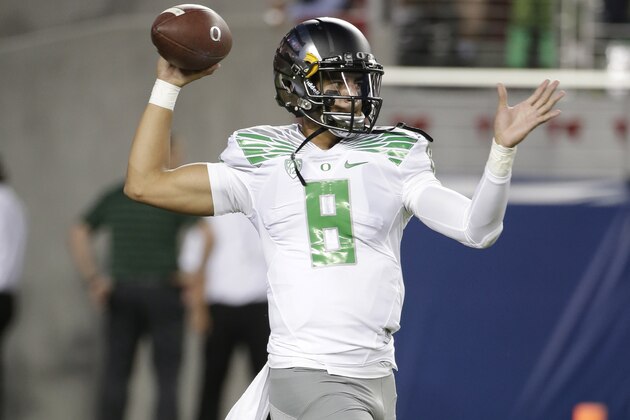 Oregon quarterback Marcus Mariota in action against California during an NCAA college football game Friday, Oct. 24, 2014, in Santa Clara, Calif. (AP Photo/Marcio Jose Sanchez)