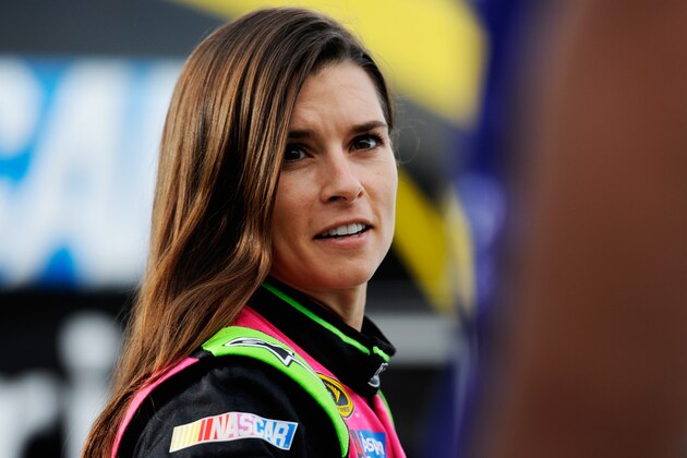 MARTINSVILLE, VA - OCTOBER 24:  Danica Patrick, driver of the #10 GoDaddy Breast Cancer Awareness Chevrolet, walks through the garage area prior to qualifying for the NASCAR Sprint Cup Series Goody's Headache Relief Shot 500 at Martinsville Speedway on October 24, 2014 in Martinsville, Virginia.  (Photo by Jared C. Tilton/Getty Images)