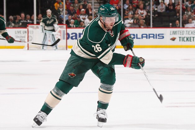 ST. PAUL, MN - OCTOBER 09: Thomas Vanek #26 of the Minnesota Wild passes the puck against the Colorado Avalanche during the season opener on October 9, 2014 at the Xcel Energy Center in St. Paul, Minnesota. (Photo by Bruce Kluckhohn/NHLI via Getty Images)