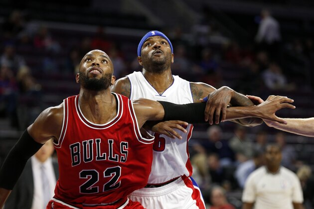 Chicago Bulls forward Taj Gibson (22) blocks out Detroit Pistons forward Josh Smith (6) in the second half of a preseason NBA basketball game in Auburn Hills, Mich., Tuesday, Oct. 7, 2014. (AP Photo/Paul Sancya)
