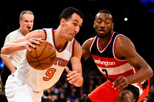 NEW YORK, NY - OCTOBER 22: Pablo Prigioni #9 of the New York Knicks drives against John Wall #2 of the Washington Wizards in a preseason game at Madison Square Garden on October 22, 2014 in New York City. NOTE TO USER: User expressly acknowledges and agrees that, by downloading and/or using this photograph, user is consenting to the terms and conditions of the Getty Images License Agreement.  (Photo by Alex Goodlett/Getty Images)
