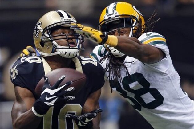 New Orleans Saints wide receiver Brandin Cooks (10) pulls in a touchdown reception in front of Green Bay Packers cornerback Tramon Williams (38) in the second half of an NFL football game in New Orleans, Sunday, Oct. 26, 2014. (AP Photo/Bill Haber)