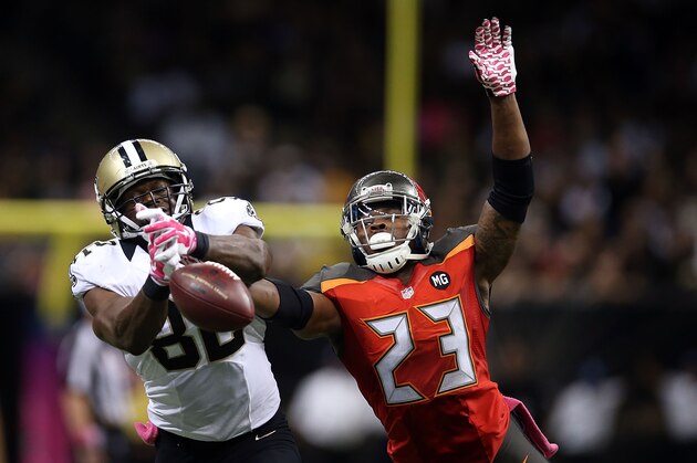 NEW ORLEANS, LA - OCTOBER 05:  Mark Barron #23 of the Tampa Bay Buccaneers defends a pass intended for Benjamin Watson #82 of the New Orleans Saints during the fourth quarter of a game at the Mercedes-Benz Superdome on October 5, 2014 in New Orleans, Louisiana.  The Saints won the game 37-31.  (Photo by Chris Graythen/Getty Images)