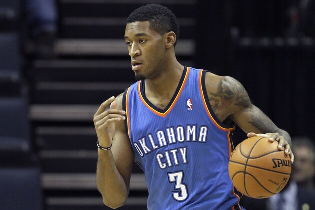 Oklahoma City Thunder forward Perry Jones dribbles the ball in the second half of an NBA basketball game against the Memphis Grizzlies in Memphis, Tenn., Wednesday, Dec. 11, 2013. The Thunder defeated the Grizzlies 116-100. (AP Photo/Danny Johnston)