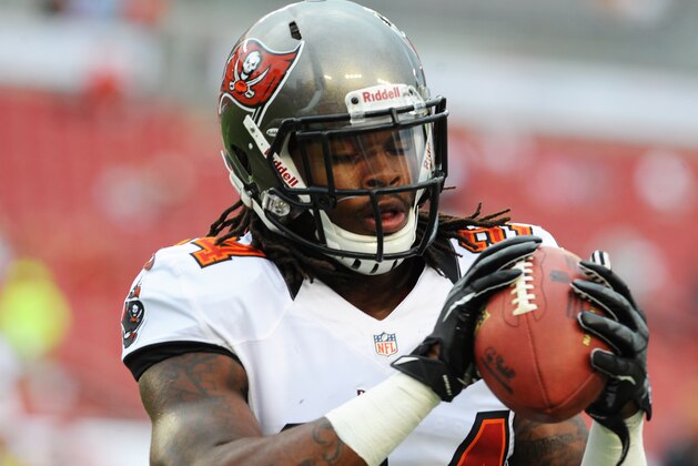 TAMPA, FL - AUGUST 17:  Safety Mark Barron #24 of the Tampa Bay Buccaneers grabs a pass during warm ups before play against the Tennessee Titans in an NFL preseason game August 17, 2012 at Raymond James Stadium in Tampa, Florida. (Photo by Al Messerschmidt/Getty Images)