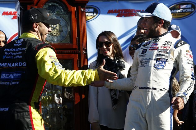 MARTINSVILLE, VA - OCTOBER 25:  Matt Crafton, driver of the #88 Ideal Door/Menards Toyota, left, congratulates Darrell Wallace, Jr., driver of the #34 2015 NASCAR Hall of Fame Inductee Wendell Scott Toyota, in Victory Lane after Wallace's victory in the NASCAR Camping World Truck Series Kroger 200 at Martinsville Speedway on October 25, 2014 in Martinsville, Virginia.  (Photo by Jeff Zelevansky/Getty Images)