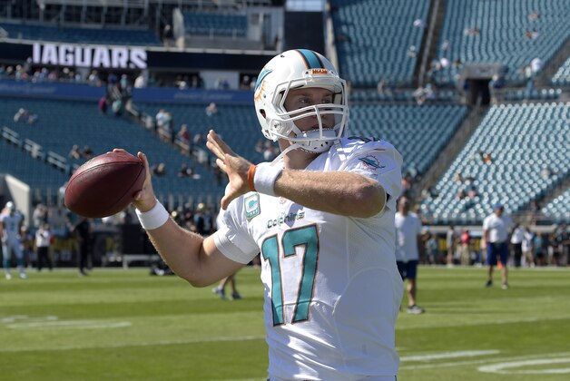 Miami Dolphins quarterback Ryan Tannehill (17) throws during warmups before an NFL football game against the Jacksonville Jaguars in Jacksonville, Fla., Sunday, Oct. 26, 2014.(AP Photo/Phelan M. Ebenhack)