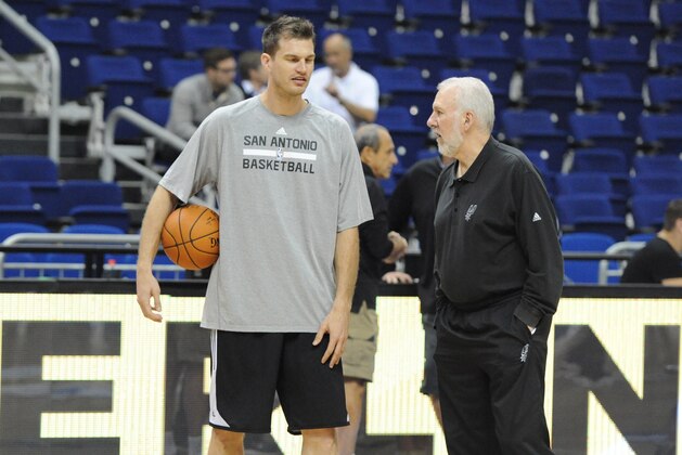 BERLIN - OCTOBER 7: Head Coach Gregg Popovich and Tiago Splitter #22 of the San Antonio Spurs talk during practice as part of the 2014 Global Games on October 7, 2014 at the O2 Arena in Berlin, Germany. NOTE TO USER: User expressly acknowledges and agrees that, by downloading and or using this photograph, User is consenting to the terms and conditions of the Getty Images License Agreement. Mandatory Copyright Notice: Copyright 2014 NBAE (Photo by Garrett Ellwood/NBAE via Getty Images)