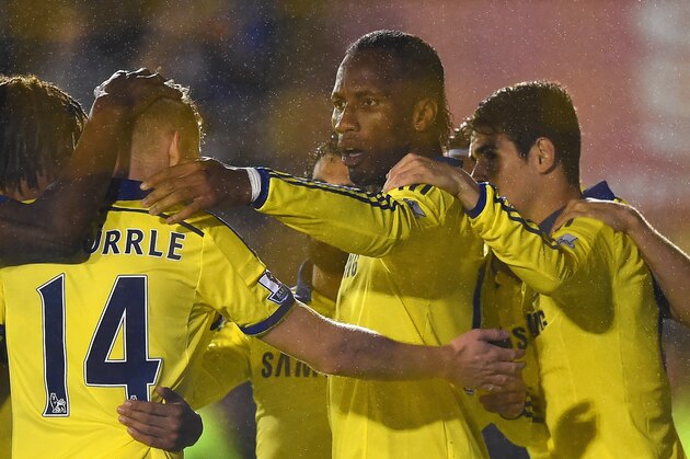SHREWSBURY, ENGLAND - OCTOBER 28:  Didier Drogba of Chelsea celebrates scoring the opening goal with team mates during the Capital One Cup Fourth Round match between Shrewsbury Town and Chelsea at Greenhous Meadow on October 28, 2014 in Shrewsbury, England.  (Photo by Laurence Griffiths/Getty Images)