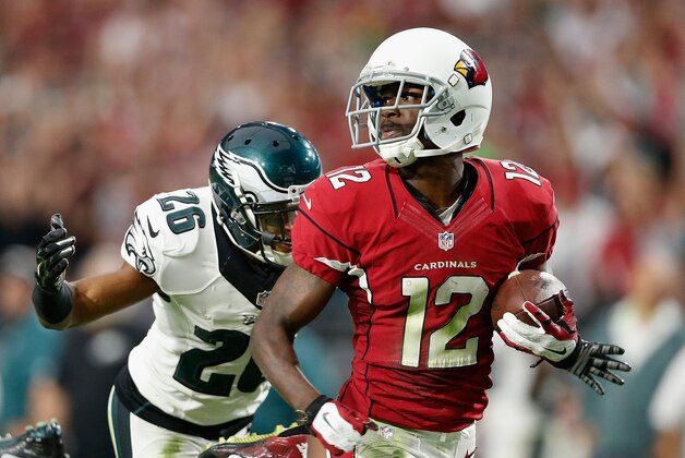 GLENDALE, AZ - OCTOBER 26:  Wide receiver John Brown #12 of the Arizona Cardinals runs with the football en route to score a 75 yard touchdown reception past cornerback Cary Williams #26 of the Philadelphia Eagles during NFL game at the University of Phoenix Stadium on October 26, 2014 in Glendale, Arizona. The Cardinals defeated the Eagles 24-20.  (Photo by Christian Petersen/Getty Images)