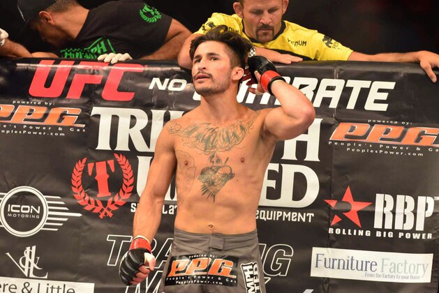 Aug 3, 2013; Rio De Janeiro, Brazil; Ian McCall (red gloves) in his corner during his fight against Iliarde Santos during UFC 163 at HSBC Arena. Mandatory Credit: Jason Silva-USA TODAY Sports