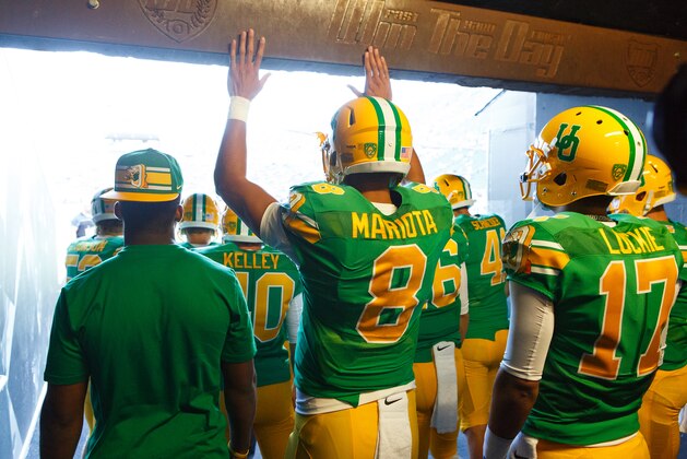 Oregon quarterback Marcus Mariota (8) walks out of the tunnel at Autzen Stadium before the start of an NCAA college football game against the Washington Huskies in Eugene, Ore., Saturday, Oct. 18, 2014. (AP Photo/Ryan Kang)